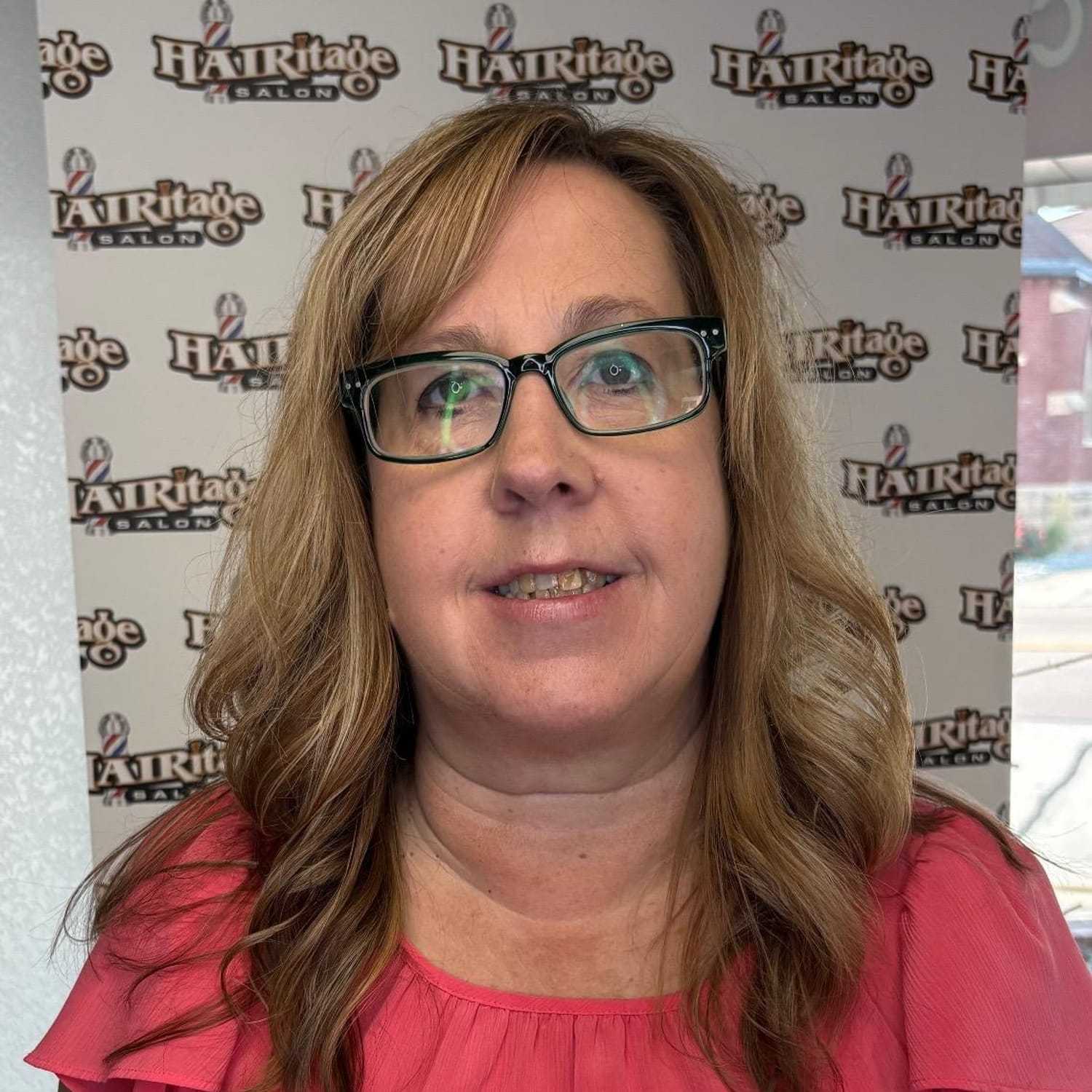 Portrait of Diane, a professional stylist at Hairitage, showcasing their expertise and style.